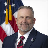 Portrait of Sean Kaufman with American Flag