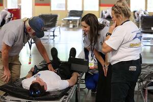 A group of people engage in a hurricane relief exercise